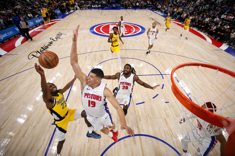 DETROIT, MI - OCTOBER 23: Simone Fontecchio #19 of the Detroit Pistons blocks shots during the game against the Indiana Pacers on October 23, 2024 at Little Caesars Arena in Detroit, Michigan. NOTE TO USER: User expressly acknowledges and agrees that, by downloading and/or using this photograph, User is consenting to the terms and conditions of the Getty Images License Agreement. Mandatory Copyright Notice: Copyright 2024 NBAE (Photo by Brian Sevald/NBAE via Getty Images)