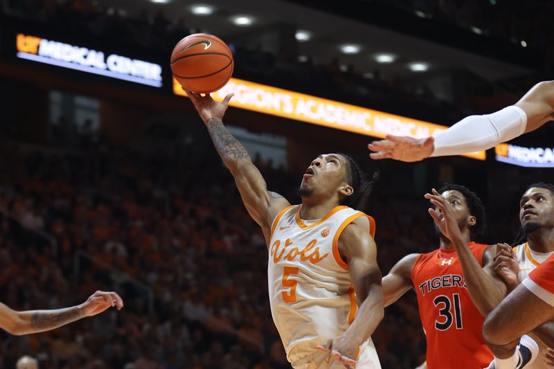 Feb 28, 2024; Knoxville, Tennessee, USA; Tennessee Volunteers guard Zakai Zeigler (5) goes to the basket against the Auburn Tigers during the second half at Thompson-Boling Arena at Food City Center. Mandatory Credit: Randy Sartin-USA TODAY Sports