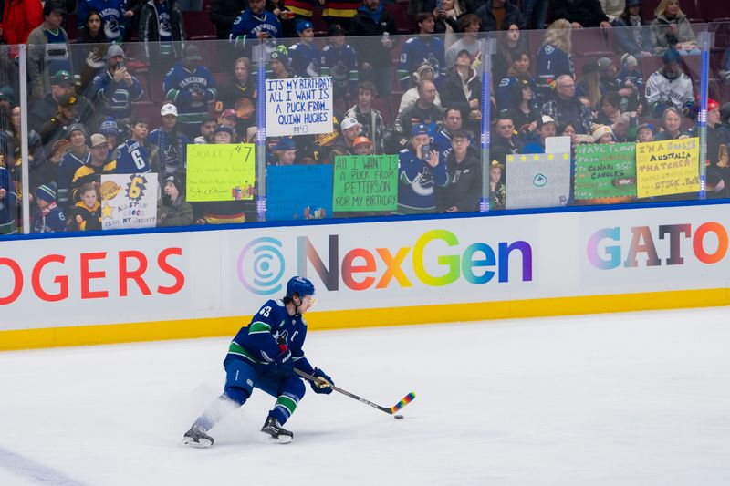 Jan 18, 2024; Vancouver, British Columbia, CAN; Vancouver Canucks defenseman Quinn Hughes (43) handles the puck during warm up prior to a game against the Arizona Coyotes at Rogers Arena. Mandatory Credit: Bob Frid-USA TODAY Sports