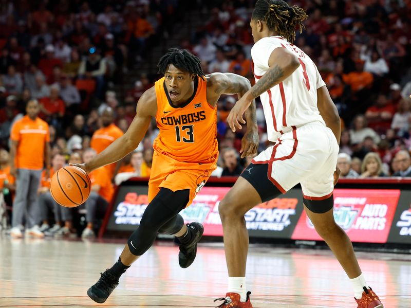 Feb 1, 2023; Norman, Oklahoma, USA; Oklahoma State Cowboys guard Quion Williams (13) moves to the basket against Oklahoma Sooners guard Otega Oweh (3) during the first half at Lloyd Noble Center. Mandatory Credit: Alonzo Adams-USA TODAY Sports