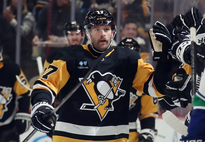 Nov 27, 2024; Pittsburgh, Pennsylvania, USA;  Pittsburgh Penguins right wing Bryan Rust (17) celebrates his second goal of the game with the Penguins bench against the Vancouver Canucks during the second period at PPG Paints Arena. Mandatory Credit: Charles LeClaire-Imagn Images