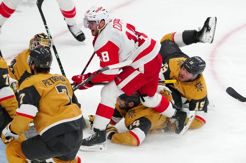 Mar 9, 2024; Las Vegas, Nevada, USA; Detroit Red Wings center Andrew Copp (18) skates past Vegas Golden Knights defenseman Nicolas Hague (14) and Vegas Golden Knights center Brendan Brisson (19) during the third period at T-Mobile Arena. Mandatory Credit: Stephen R. Sylvanie-USA TODAY Sports