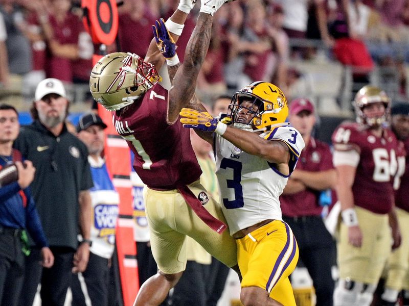 Sep 3, 2023; Orlando, Florida, USA; Florida State Seminoles wide receiver Destyn Hill (7) cannot bring in a pass as he is defended by LSU Tigers safety Greg Brooks Jr (3) during the first half at Camping World Stadium. Mandatory Credit: Melina Myers-USA TODAY Sports
