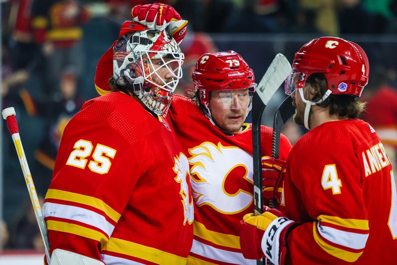 Mar 28, 2023; Calgary, Alberta, CAN; Calgary Flames goaltender Jacob Markstrom (25) celebrate win with teammates over Los Angeles Kings at Scotiabank Saddledome. Mandatory Credit: Sergei Belski-USA TODAY Sports