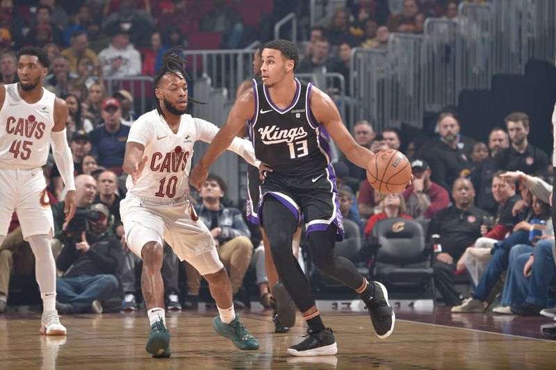 CLEVELAND, OH - FEBRUARY 5: Keegan Murray #13 of the Sacramento Kings handles the ball against Darius Garland #10 of the Cleveland Cavaliers during the game on February 5, 2024 at Rocket Mortgage FieldHouse in Cleveland, Ohio. NOTE TO USER: User expressly acknowledges and agrees that, by downloading and/or using this Photograph, user is consenting to the terms and conditions of the Getty Images License Agreement. Mandatory Copyright Notice: Copyright 2024 NBAE (Photo by David Liam Kyle/NBAE via Getty Images)