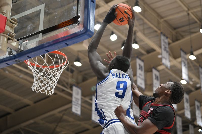 Feb 15, 2025; Durham, North Carolina, USA;  Duke Blue Devils center Khaman Maluach (9) dunks the ball during the second half against the Stanford Cardinal at Cameron Indoor Stadium. Blue Devils won 106-70. Mandatory Credit: Zachary Taft-Imagn Images