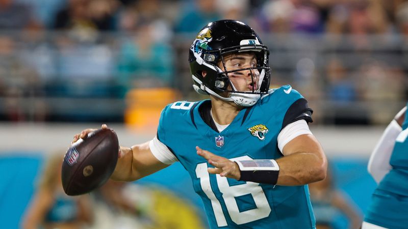 Jacksonville Jaguars quarterback Nathan Rourke (18) in action during an NFL pre-season football game against the Miami Dolphins, Saturday, Aug. 26, 2023, in Jacksonville, Fla. The Jaguars defeated the Dolphins 31-18. (AP Photo/Gary McCullough)