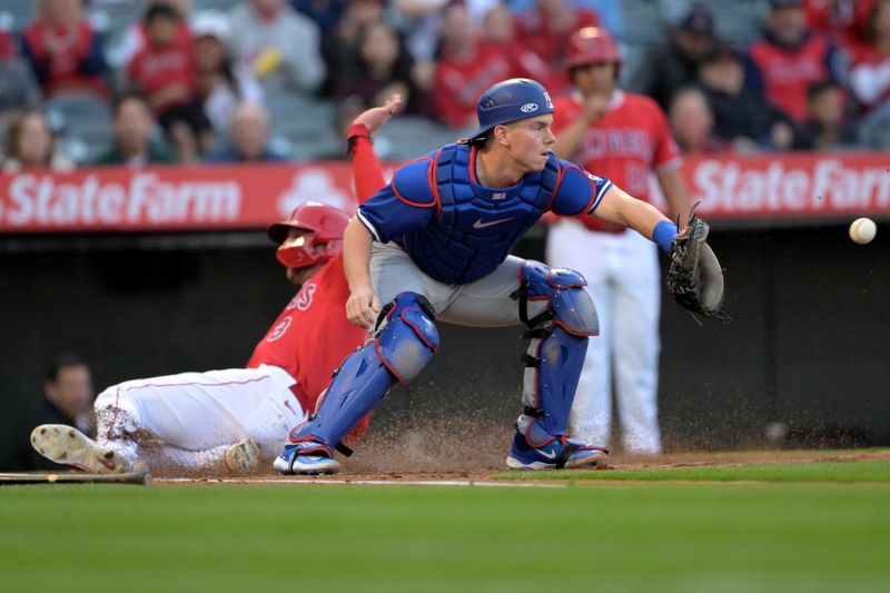 Mar 26, 2024; Anaheim, California, USA;  Los Angeles Angels shortstop Zach Neto (9) beats the throw to Los Angeles Dodgers catcher Will Smith (16) to score a run in the first inning at Angel Stadium. Mandatory Credit: Jayne Kamin-Oncea-USA TODAY Sports