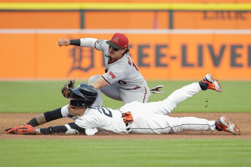 Jun 9, 2023; Detroit, Michigan, USA; Arizona Diamondbacks shortstop Josh Rojas (10) tags out Detroit Tigers Javier B ez (28) at third base during the first inning at Comerica Park. Mandatory Credit: Brian Bradshaw Sevald-USA TODAY Sports