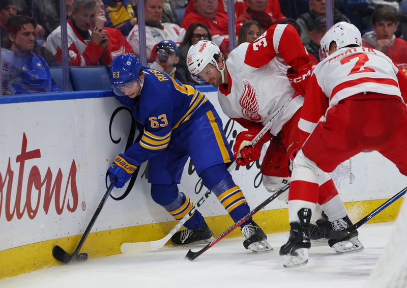 Dec 5, 2023; Buffalo, New York, USA;  Buffalo Sabres left wing Jeff Skinner (53) and Detroit Red Wings right wing Christian Fischer (36) battle for a loose puck along the boards during the second period at KeyBank Center. Mandatory Credit: Timothy T. Ludwig-USA TODAY Sports