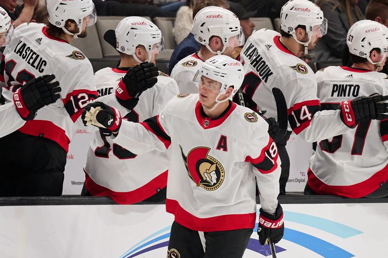 Mar 9, 2024; San Jose, California, USA; Ottawa Senators center Tim Stutzle (18) shakes hands with his teammates after scoring a goal against the San Jose Sharks during the second period at SAP Center at San Jose. Mandatory Credit: Robert Edwards-USA TODAY Sports