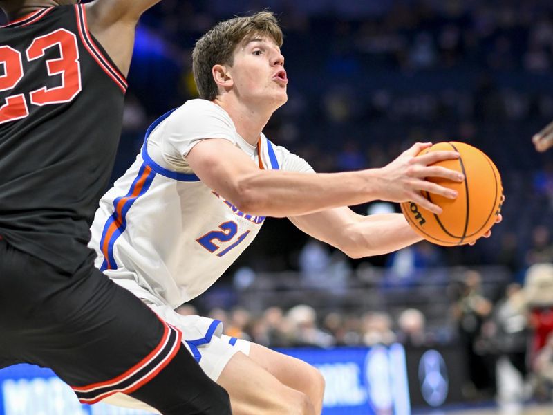 Mar 14, 2024; Nashville, TN, USA;  Florida Gators forward Alex Condon (21) fakes a pass against the Georgia Bulldogs during the second half at Bridgestone Arena. Mandatory Credit: Steve Roberts-USA TODAY Sports