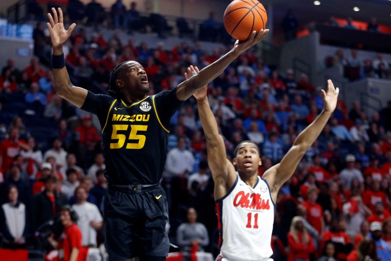 Feb 17, 2024; Oxford, Mississippi, USA; Missouri Tigers guard Sean East II (55) shoots during the first half against the Mississippi Rebels at The Sandy and John Black Pavilion at Ole Miss. Mandatory Credit: Petre Thomas-USA TODAY Sports