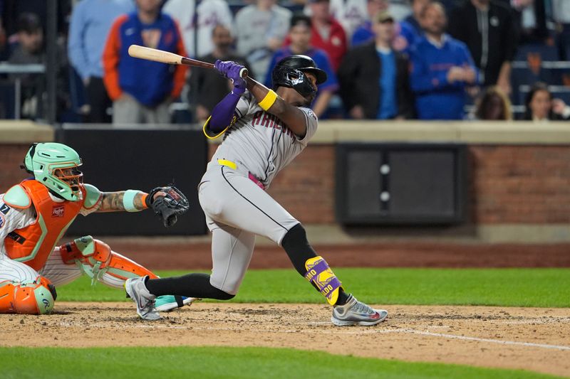 Apr 30, 2025; New York City, New York, USA; Arizona Diamondbacks shortstop Geraldo Perdomo (2) hits an RBI single against the New York Mets during the seventh inning at Citi Field. Mandatory Credit: Gregory Fisher-Imagn Images