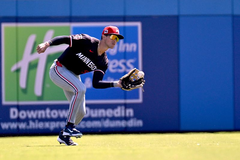 Mar 11, 2025; Dunedin, Florida, USA; Minnesota Twins left fielder Armando Alvarez (56) catches a line drive in the first inning against the Toronto Blue Jays during spring training  at TD Ballpark. Mandatory Credit: Jonathan Dyer-Imagn Images