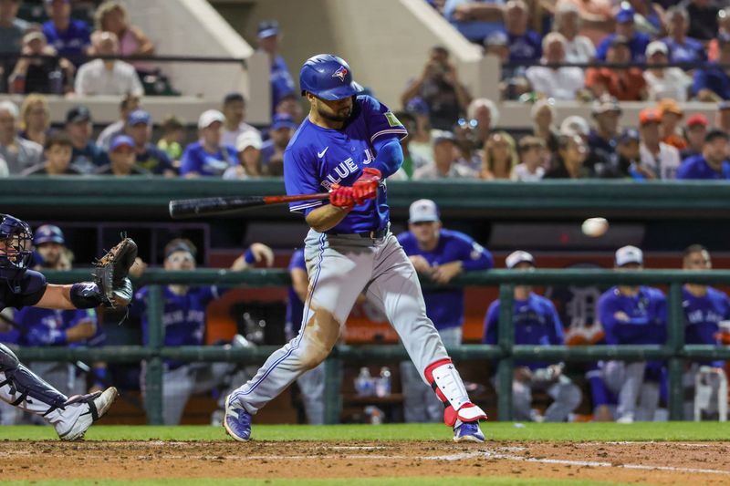 Mar 7, 2024; Lakeland, Florida, USA; Toronto Blue Jays shortstop Isiah Kiner-Falefa (7) hits an RBI single during the fourth inning against the Detroit Tigers at Publix Field at Joker Marchant Stadium. Mandatory Credit: Mike Watters-USA TODAY Sports