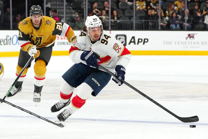 Jan 4, 2024; Las Vegas, Nevada, USA; Florida Panthers left wing Ryan Lomberg (94) skates ahead of Vegas Golden Knights center Brett Howden (21) during the third period at T-Mobile Arena. Mandatory Credit: Stephen R. Sylvanie-USA TODAY Sports