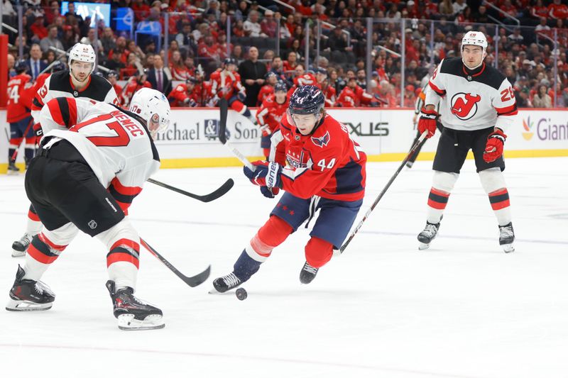 Mar 20, 2026; Washington, District of Columbia, USA; Washington Capitals defenseman Cole Hutson (44) skates with the puck as New Jersey Devils defenseman Simon Nemec (17) defends during the first half at Capital One Arena. Mandatory Credit: Amber Searls-Imagn Images