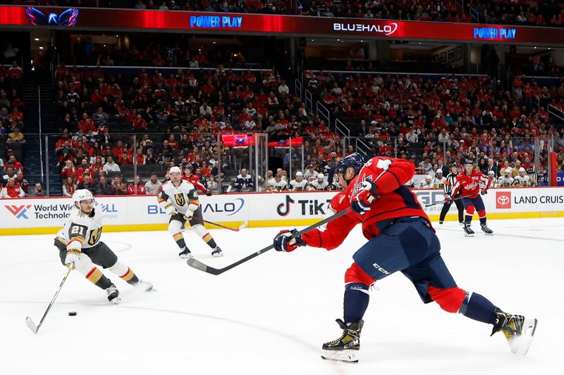 Oct 15, 2024; Washington, District of Columbia, USA; Washington Capitals left wing Alex Ovechkin (8) shoots the puck as Vegas Golden Knights center Brett Howden (21) defends in the first period at Capital One Arena. Mandatory Credit: Geoff Burke-Imagn Images