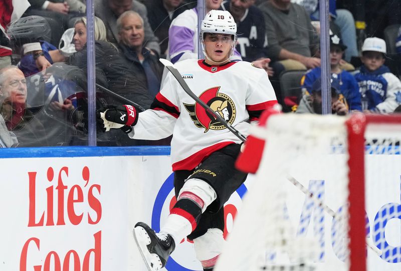 Nov 12, 2024; Toronto, Ontario, CAN; Ottawa Senators center Tim Stutzle (18) celebrates after a goal against the Toronto Maple Leafs during the second period at Scotiabank Arena. Mandatory Credit: Nick Turchiaro-Imagn Images