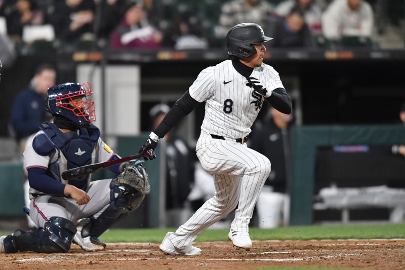Apr 2, 2024; Chicago, Illinois, USA; Chicago White Sox second baseman Nicky Lopez (8) singles during the fifth inning against the Atlanta Braves at Guaranteed Rate Field. Mandatory Credit: Patrick Gorski-USA TODAY Sports