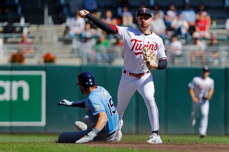 Sep 13, 2023; Minneapolis, Minnesota, USA; Minnesota Twins second baseman Edouard Julien (47) forces out Tampa Bay Rays right fielder Joshua Lowe (15) but cannot complete the double play in the third inning at Target Field. Mandatory Credit: Bruce Kluckhohn-USA TODAY Sports