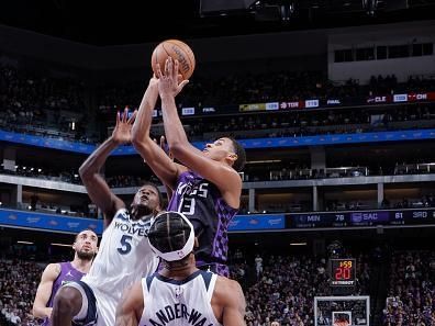 SACRAMENTO, CA - DECEMBER 23: Keegan Murray #13 of the Sacramento Kings drives to the basket during the game against the Minnesota Timberwolves on December 23, 2023 at Golden 1 Center in Sacramento, California. NOTE TO USER: User expressly acknowledges and agrees that, by downloading and or using this Photograph, user is consenting to the terms and conditions of the Getty Images License Agreement. Mandatory Copyright Notice: Copyright 2023 NBAE (Photo by Rocky Widner/NBAE via Getty Images)