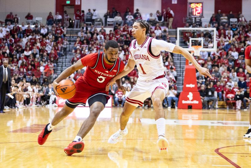 Jan 2, 2025; Bloomington, Indiana, USA; Rutgers Scarlet Knights guard Tyson Acuff (5) dribbles  the ball while Indiana Hoosiers guard Myles Rice (1) defends in the second half at Simon Skjodt Assembly Hall. Mandatory Credit: Trevor Ruszkowski-Imagn Images