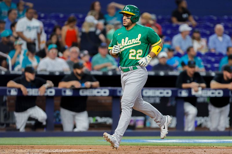 Jun 4, 2023; Miami, Florida, USA; Oakland Athletics right fielder Ramon Laureano (22) scores after a throwing error by Miami Marlins starting pitcher Sandy Alcantara (not pictured) during the third inning at loanDepot Park. Mandatory Credit: Sam Navarro-USA TODAY Sports