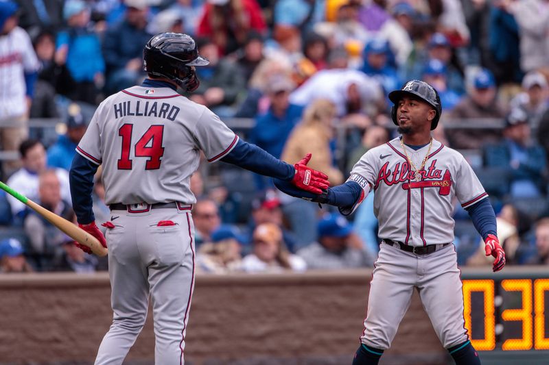 Apr 16, 2023; Kansas City, Missouri, USA; Atlanta Braves second baseman Ozzie Albies (1) slaps hands with Atlanta Braves center fielder Sam Hilliard (14) after scoring during the ninth inning against the Kansas City Royals at Kauffman Stadium. Mandatory Credit: William Purnell-USA TODAY Sports