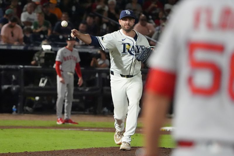 Sep 21, 2025; Tampa, Florida, USA; Tampa Bay Rays relief pitcher Cole Sulser (71) throws to first against the Boston Red Sox during the fifth inning at George M. Steinbrenner Field. Mandatory Credit: Dave Nelson-Imagn Images