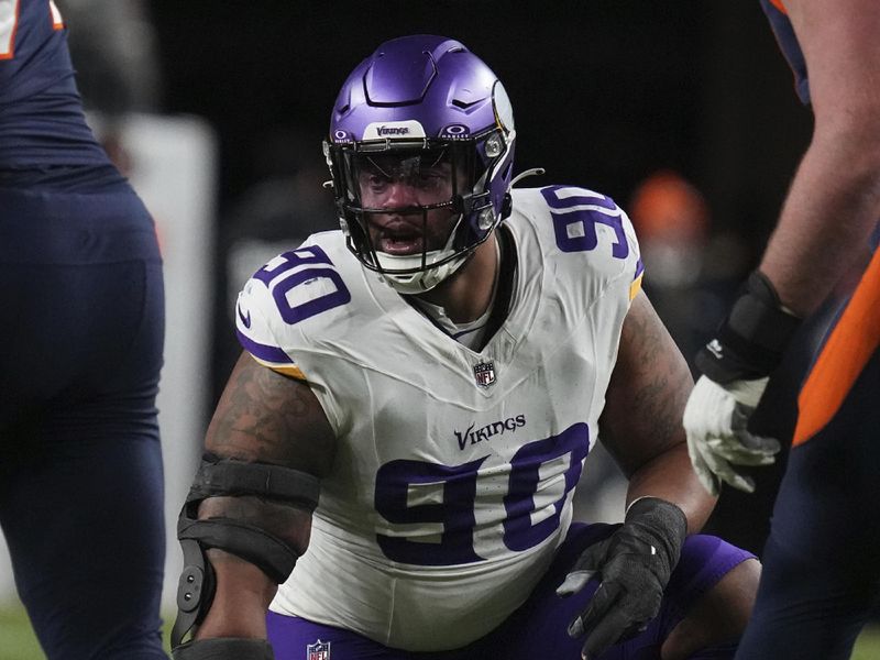 Minnesota Vikings defensive end Jonathan Bullard (90) against the Denver Broncos of an NFL football game Sunday November 19, 2023, in Denver. (AP Photo/Bart Young)