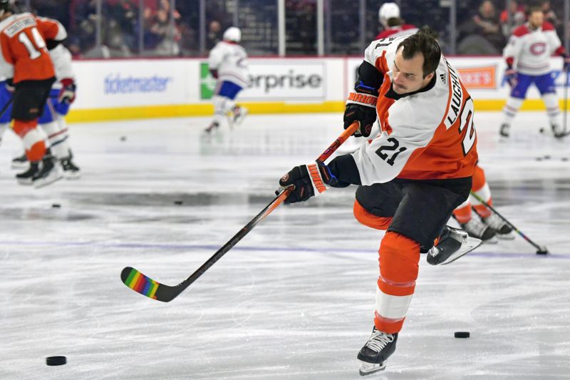 Jan 10, 2024; Philadelphia, Pennsylvania, USA; Philadelphia Flyers center Scott Laughton (21) with tape on his stick for support of LGBTQ+ community at the annual Pride Game against the Montreal Canadiens at Wells Fargo Center. Mandatory Credit: Eric Hartline-USA TODAY Sports