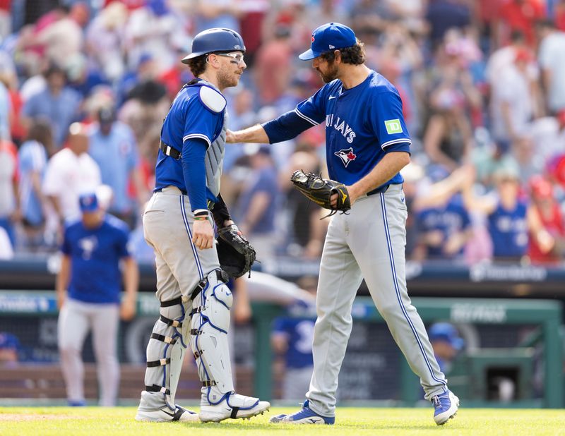 May 8, 2024; Philadelphia, Pennsylvania, USA; Toronto Blue Jays pitcher Jordan Romano (68) and catcher Danny Jansen (9) react to a victory against the Philadelphia Phillies at Citizens Bank Park. Mandatory Credit: Bill Streicher-USA TODAY Sports