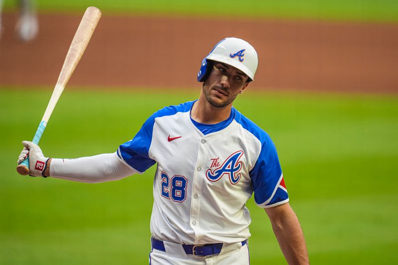 Jul 6, 2024; Cumberland, Georgia, USA; Atlanta Braves first baseman Matt Olson (28) reacts after being called out on strikes against the Philadelphia Phillies during the first inning at Truist Park. Mandatory Credit: Dale Zanine-USA TODAY Sports