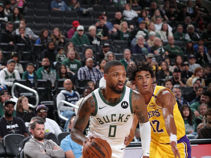 MILWAUKEE, WI - OCTOBER 10: Damian Lillard #0 of the Milwaukee Bucks drives to the basket during the game against the Los Angeles Lakers during a preseason game on October 10, 2024 at Fiserv Forum Center in Milwaukee, Wisconsin. NOTE TO USER: User expressly acknowledges and agrees that, by downloading and or using this Photograph, user is consenting to the terms and conditions of the Getty Images License Agreement. Mandatory Copyright Notice: Copyright 2024 NBAE (Photo by Gary Dineen/NBAE via Getty Images).