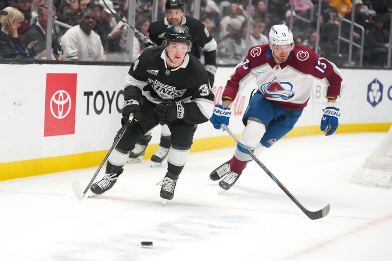 Mar 2, 2026; Los Angeles, California, USA; Colorado Avalanche right wing Valeri Nichushkin (13) and LA Kings center Kenny Connors (34) battle for the puck in the first period at Crypto.com Arena. Mandatory Credit: Kirby Lee-Imagn Images