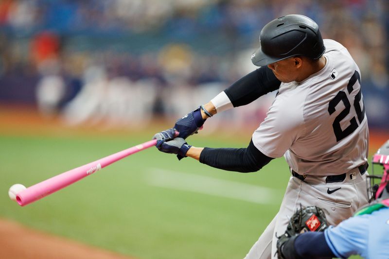 May 12, 2024; St. Petersburg, Florida, USA;  New York Yankees outfielder Juan Soto (22) singles against the Tampa Bay Rays in the fifth inning at Tropicana Field. Mandatory Credit: Nathan Ray Seebeck-USA TODAY Sports
