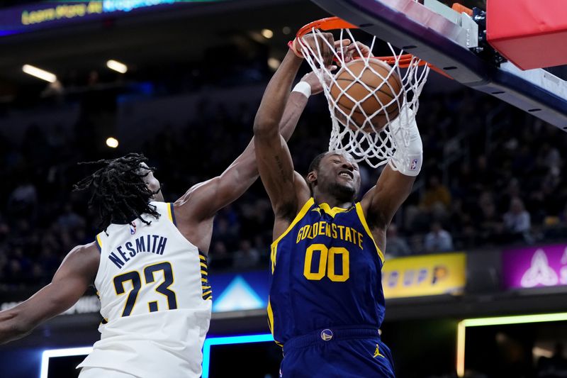 INDIANAPOLIS, INDIANA - FEBRUARY 08: Jonathan Kuminga #00 of the Golden State Warriors dunks against Aaron Nesmith #23 of the Indiana Pacers in the fourth quarter at Gainbridge Fieldhouse on February 08, 2024 in Indianapolis, Indiana. NOTE TO USER: User expressly acknowledges and agrees that, by downloading and or using this photograph, User is consenting to the terms and conditions of the Getty Images License Agreement. (Photo by Dylan Buell/Getty Images)