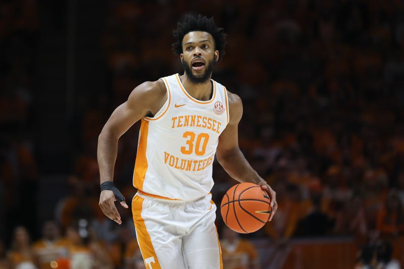 Jan 20, 2024; Knoxville, Tennessee, USA; Tennessee Volunteers guard Josiah-Jordan James (30) brings the ball up court against the Alabama Crimson Tide during the first half at Thompson-Boling Arena at Food City Center. Mandatory Credit: Randy Sartin-USA TODAY Sports