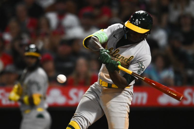 Jul 27, 2024; Anaheim, California, USA; Oakland Athletics outfielder Lawrence Butler (4) flies out against the Los Angeles Angels during the eighth inning at Angel Stadium. Mandatory Credit: Jonathan Hui-USA TODAY Sports