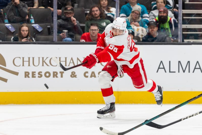 Nov 18, 2024; San Jose, California, USA; Detroit Red Wings defenseman Erik Gustafsson (56) takes a shot during the first period against the San Jose Sharks at SAP Center at San Jose. Mandatory Credit: Bob Kupbens-Imagn Images