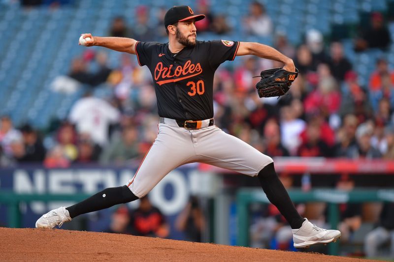 Apr 23, 2024; Anaheim, California, USA; Baltimore Orioles pitcher Grayson Rodriguez (30) throws against the Los Angeles Angels during the first inning at Angel Stadium. Mandatory Credit: Gary A. Vasquez-USA TODAY Sports