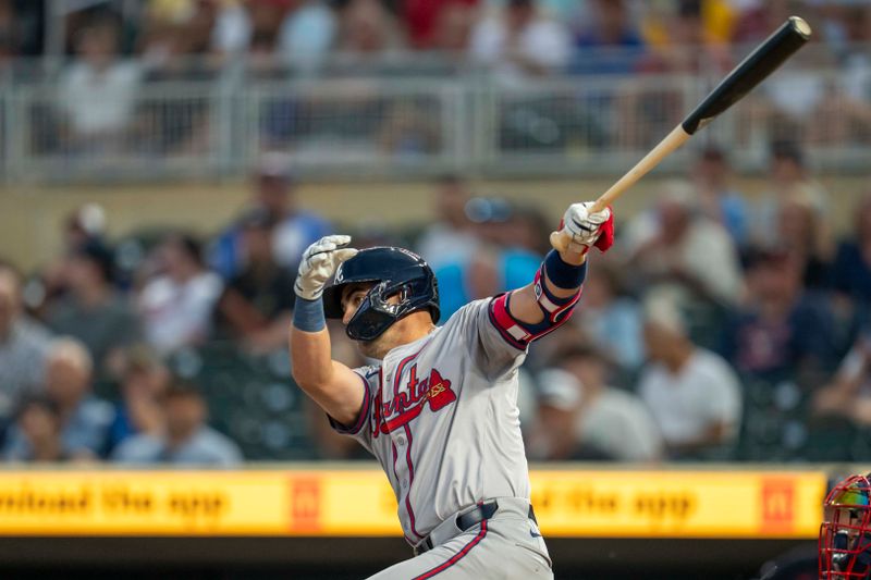 Aug 26, 2024; Minneapolis, Minnesota, USA; Atlanta Braves second baseman Whit Merrifield (15) hits a single against the Minnesota Twins in the first inning at Target Field. Mandatory Credit: Jesse Johnson-USA TODAY Sports