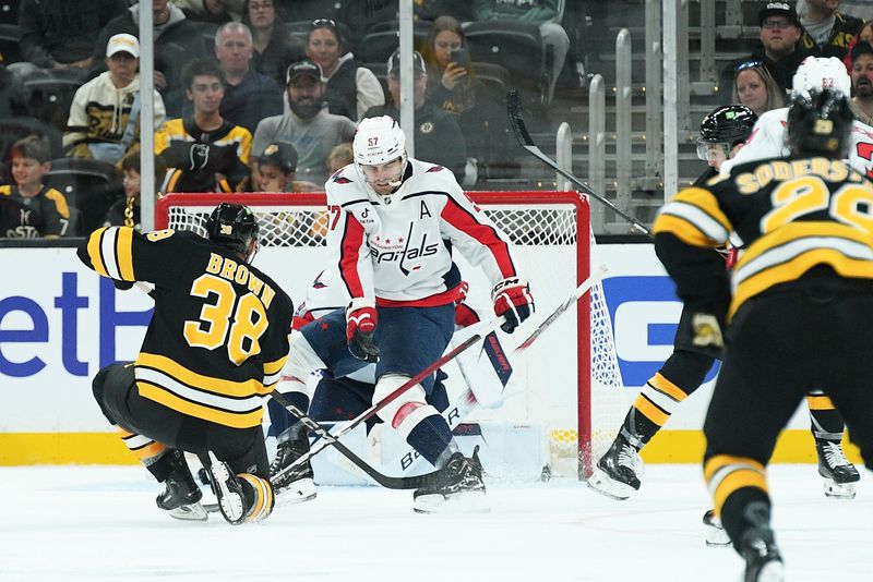 Sep 21, 2025; Boston, Massachusetts, USA; Boston Bruins center Patrick Brown (38) scores a goal past Washington Capitals goaltender Logan Thompson (48) during the second period at TD Garden. Mandatory Credit: Bob DeChiara-Imagn Images