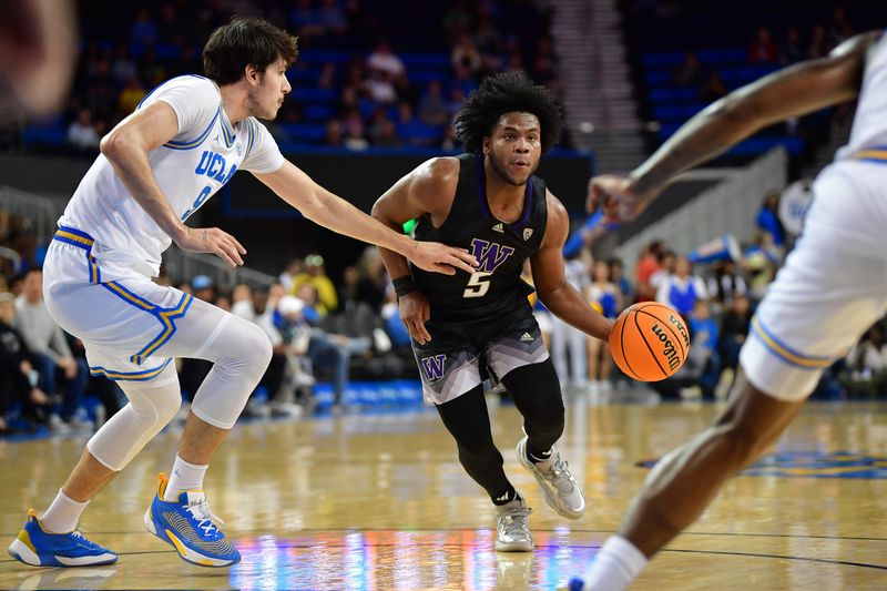 January 14, 2024; Los Angeles, California, USA; Washington Huskies guard Sahvir Wheeler (5) moves the ball against UCLA Bruins forward Berke Buyuktuncel (9) during the first half at Pauley Pavilion. Mandatory Credit: Gary A. Vasquez-USA TODAY Sports