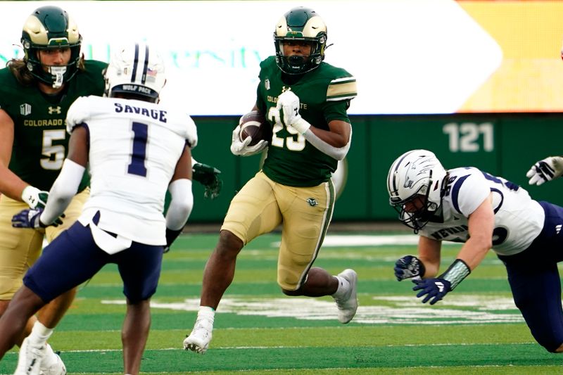 Nov 18, 2023; Fort Collins, Colorado, USA;  Colorado State Rams running back Justin Marshall (29) running back Justin Marshall (29) finds running room against the Nevada Wolf Pack at Sonny Lubick Field at Canvas Stadium. Mandatory Credit: Michael Madrid-USA TODAY Sports