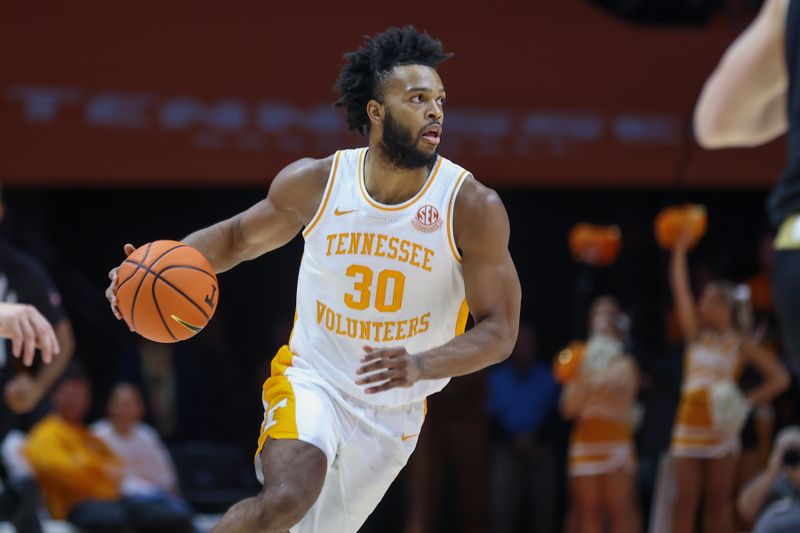 Nov 14, 2023; Knoxville, Tennessee, USA; Tennessee Volunteers guard Josiah-Jordan James (30) brings the ball up court against the Wofford Terriers during the first half at Thompson-Boling Arena at Food City Center. Mandatory Credit: Randy Sartin-USA TODAY Sports