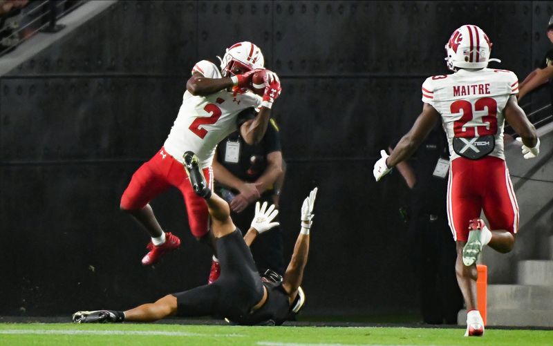 Sep 22, 2023; West Lafayette, Indiana, USA; Wisconsin Badgers cornerback Ricardo Hallman (2) intercepts a pass against Purdue Boilermakers wide receiver Jayden Dixon-Veal (0) during the first half at Ross-Ade Stadium. Mandatory Credit: Robert Goddin-USA TODAY Sports