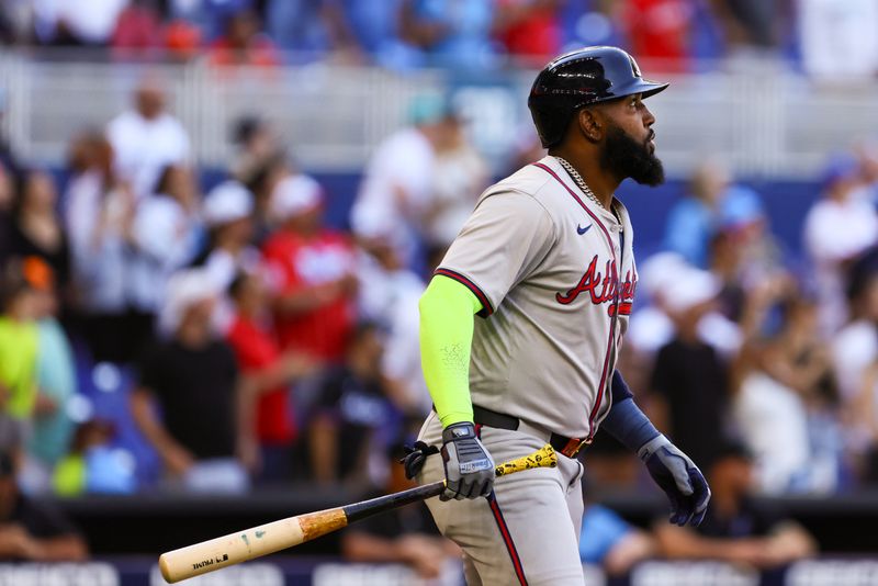 Apr 14, 2024; Miami, Florida, USA; Atlanta Braves designated hitter Marcell Ozuna (20) watches after hitting a two-run home run against the Miami Marlins during the ninth inning at loanDepot Park. Mandatory Credit: Sam Navarro-USA TODAY Sports